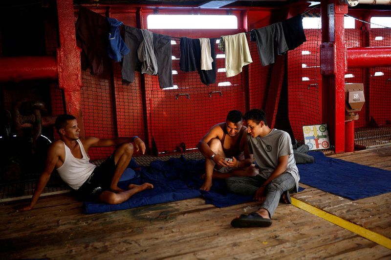 Rescue boat celebrates as stranded migrants given ok to disembark in Italy - Vimarsana News