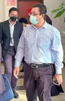 Former district council president facing four charges of graft
