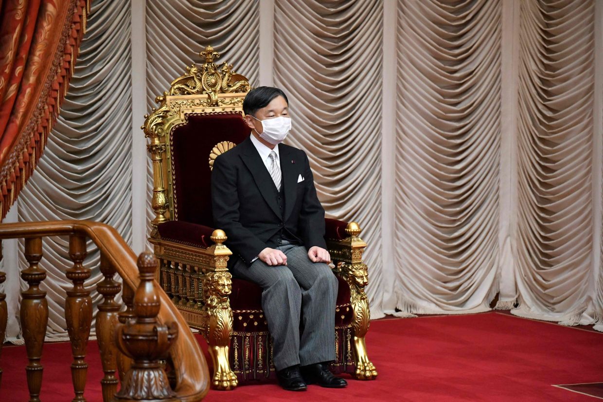 Japan's Emperor Naruhito takes part in the opening ceremony of an extraordinary Diet session at the National Diet building in Tokyo on October 3, 2022. - AFP