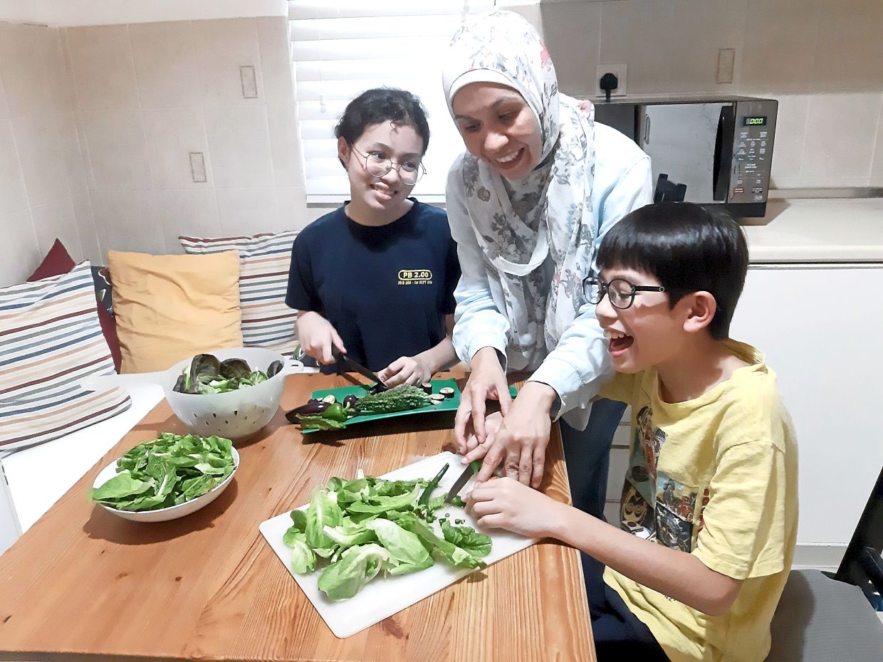 Malaysian saves about RM500 a year by planting greens in her garden