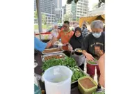 Farmers market traders in Section 17 give residents a potluck treat