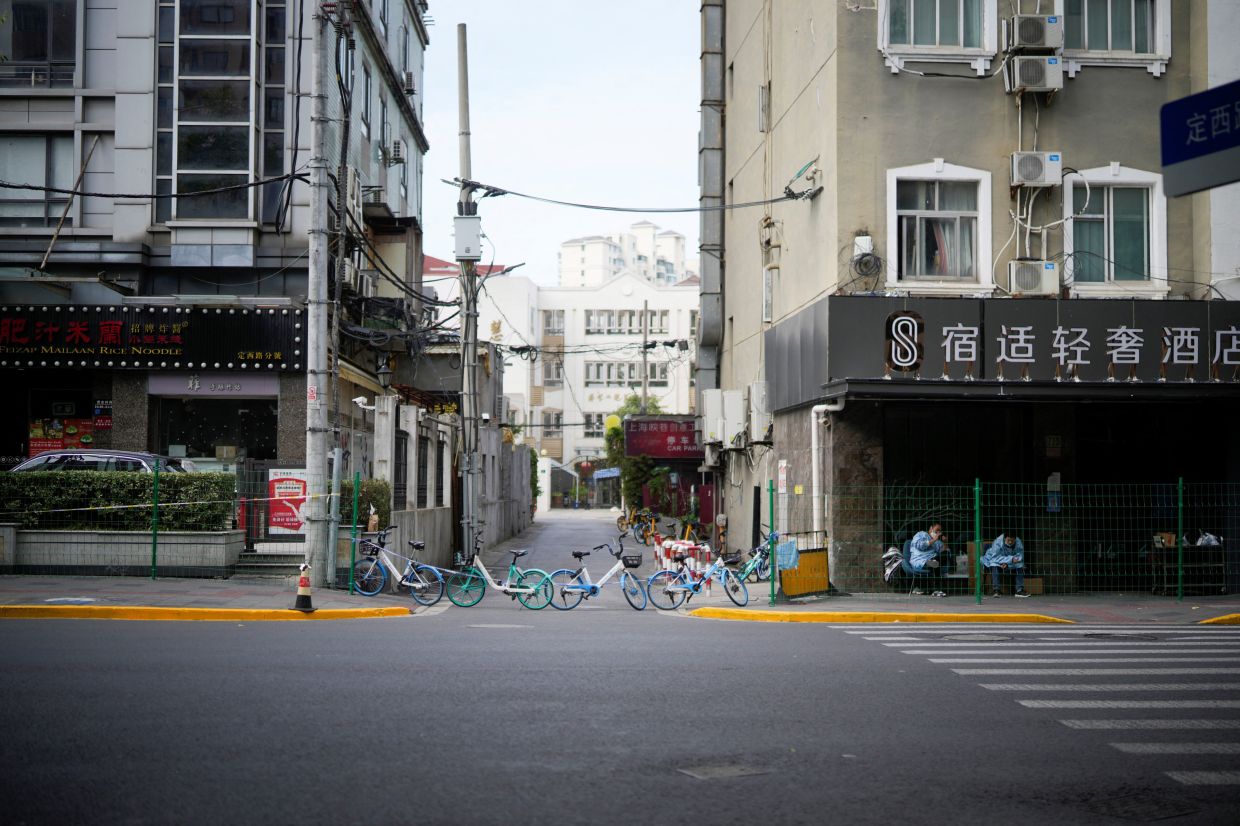 An entrance is blocked by bicycles from a bike-sharing service at a sealed area following the coronavirus disease (Covid-19) outbreak in Shanghai, China. - Reuters