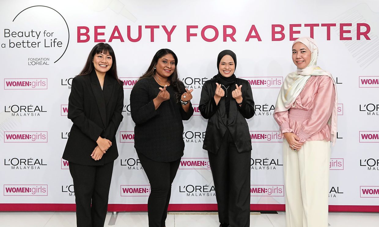 (from left) Izza from Women: Girls, participants Gunasundari and Annies, Finas from L'Oreal Foundation, at the Beauty for a Better Life launch. Photo: The Star/Yap Chee Hong