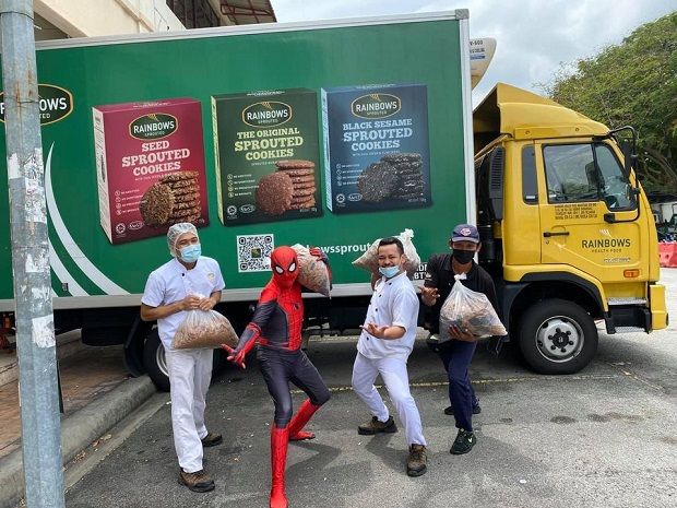 Rainbows Health Food staff and friendly neighbourhood Spiderman on behalf of fundraising platform GoCare Donation Crowd Funding, an initiative by MCA's Crisis Relief Squad, to collect surplus bread.