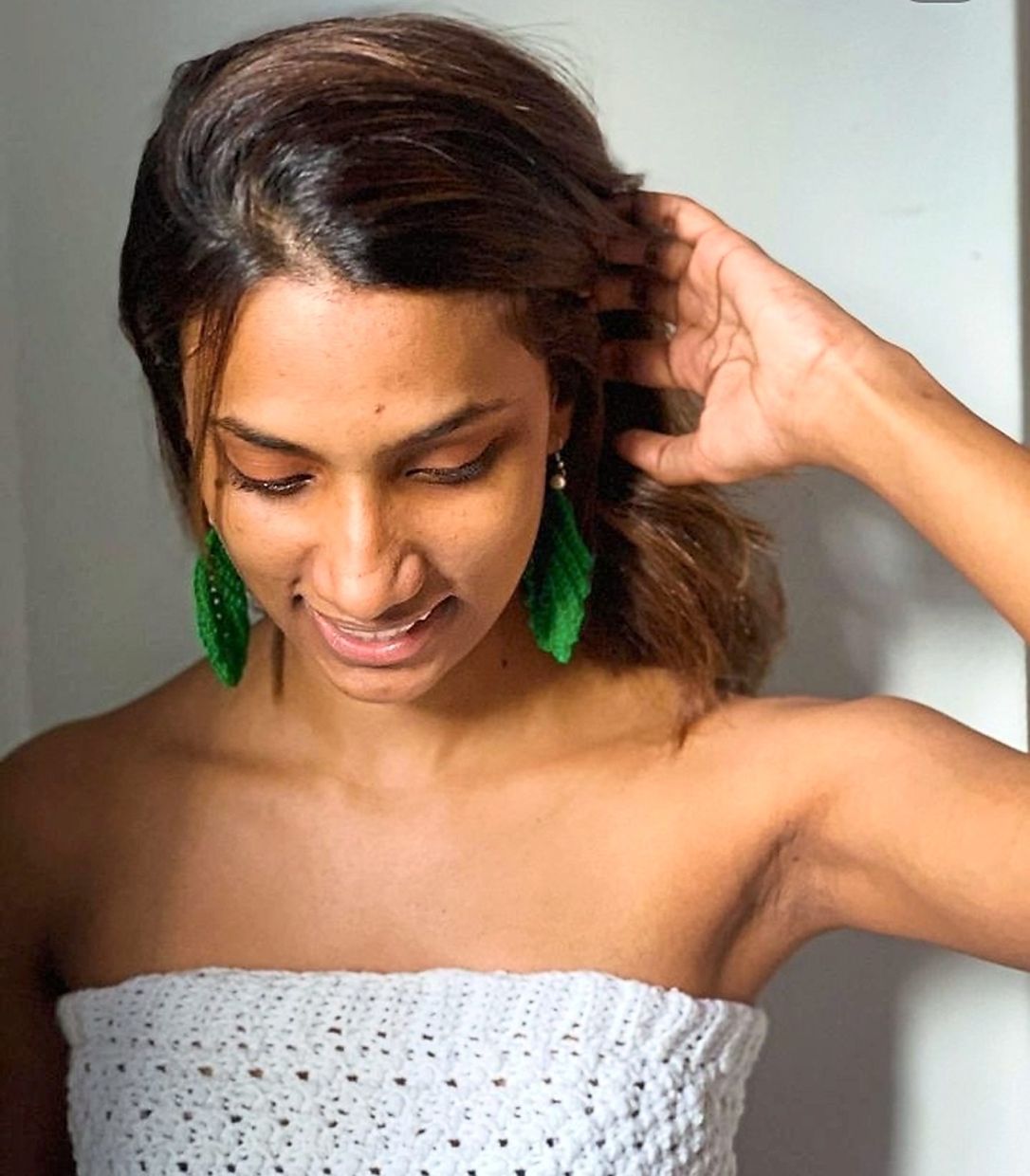 Yuveneswary is proud to model her mother's handmade crochet earrings and tube top. Photo: Yuveneswary Maheswaran