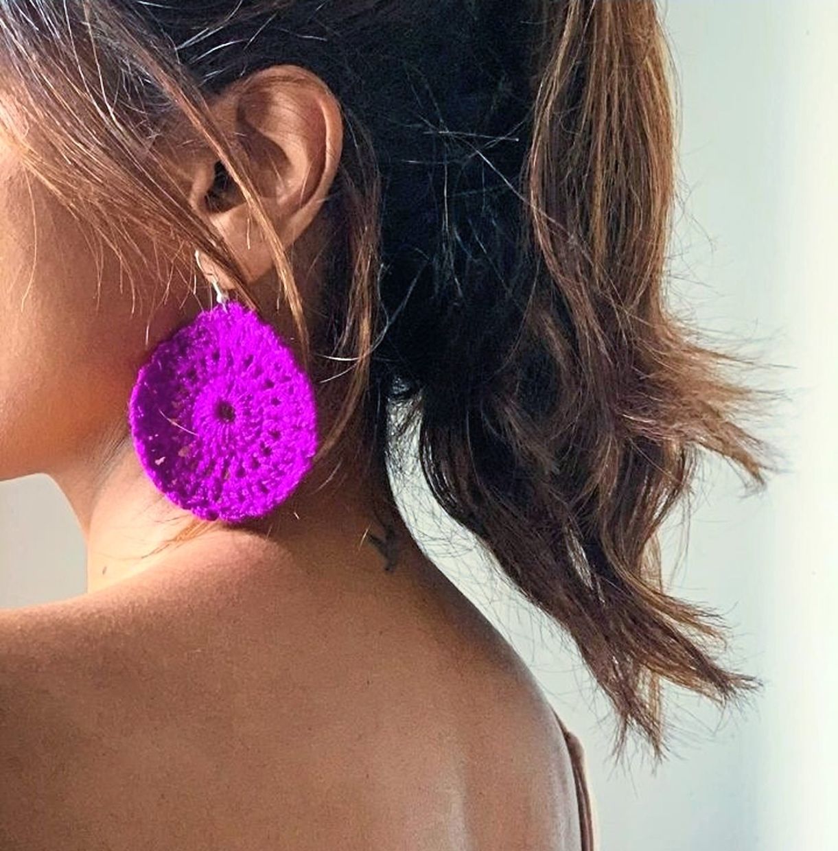 A crochet flat circle turned into a dangling earring. Photo: Yuveneswary Maheswaran