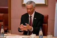 Singapore PM says political succession to coincide with general elections due in 2025