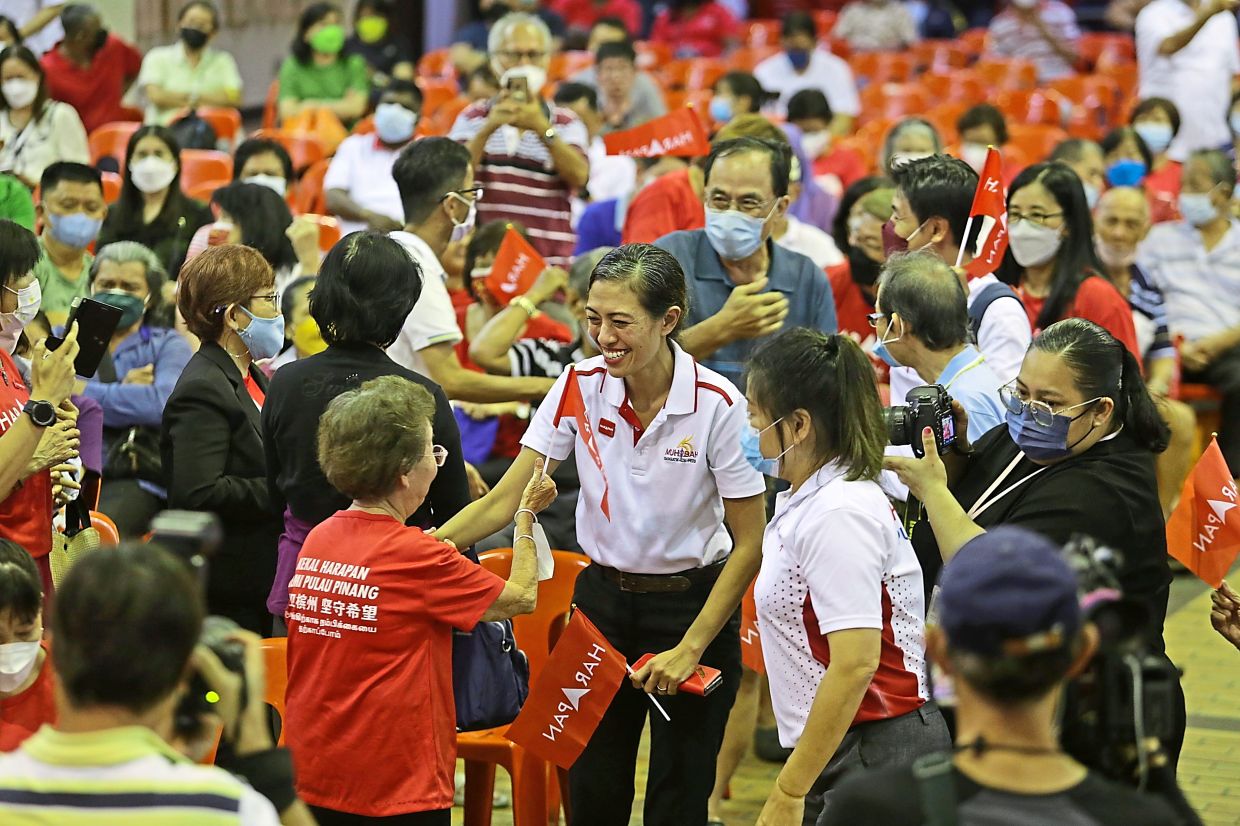 Meaningful interactions: Syerleena greeting the audience before the start of a ceramah at the Penang Chinese Town Hall; 