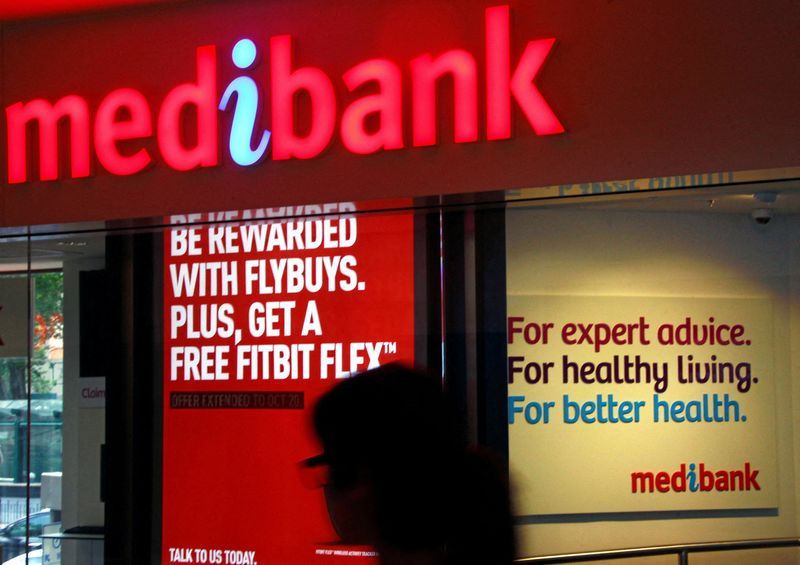 FILE PHOTO A woman walks past a branch of the Australian health insurer Medibank Private in Sydney October 20 2014. REUTERSDavid GrayFile Photo