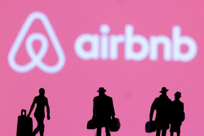 FILE PHOTO Figurines are seen in front of the Airbnb logo in this illustration taken February 27 2022. REUTERSDado RuvicIllustration