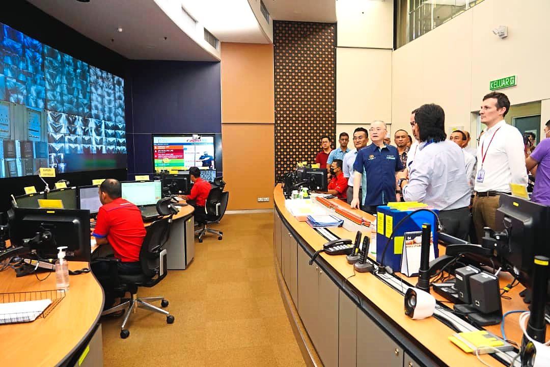 Inspection: Dr Wee (in blue shirt) being briefed by Rapid Rail senior management at the Kelana Jaya train control centre alongside Thales Group representatives, with Mohd Azharuddin standing behind him.