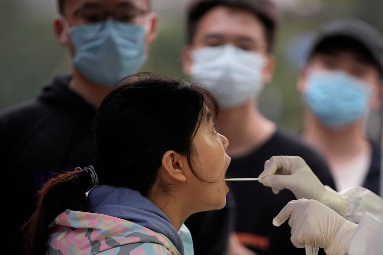 China's Covid-19 infections reach peak since late April; daily cases now hitting five figures - Vimarsana News