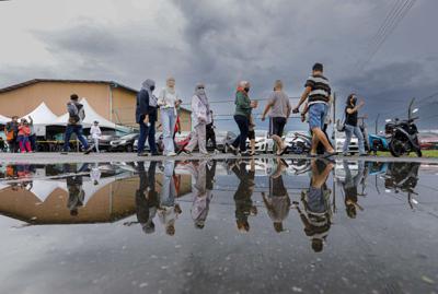 Voters\' leaving the polling station at the Batu Kawa community hall, in Kuching. — ZULAZHAR SHEBLEE/The Star