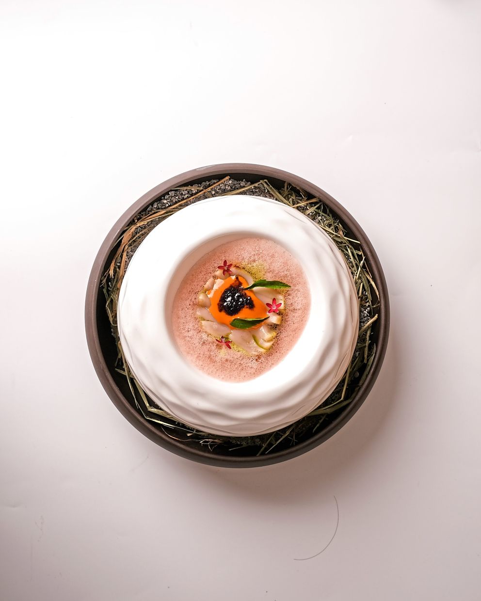 Velvety soft scallop is juxtaposed brilliantly against an aromatic kaffir lime leaf oil.