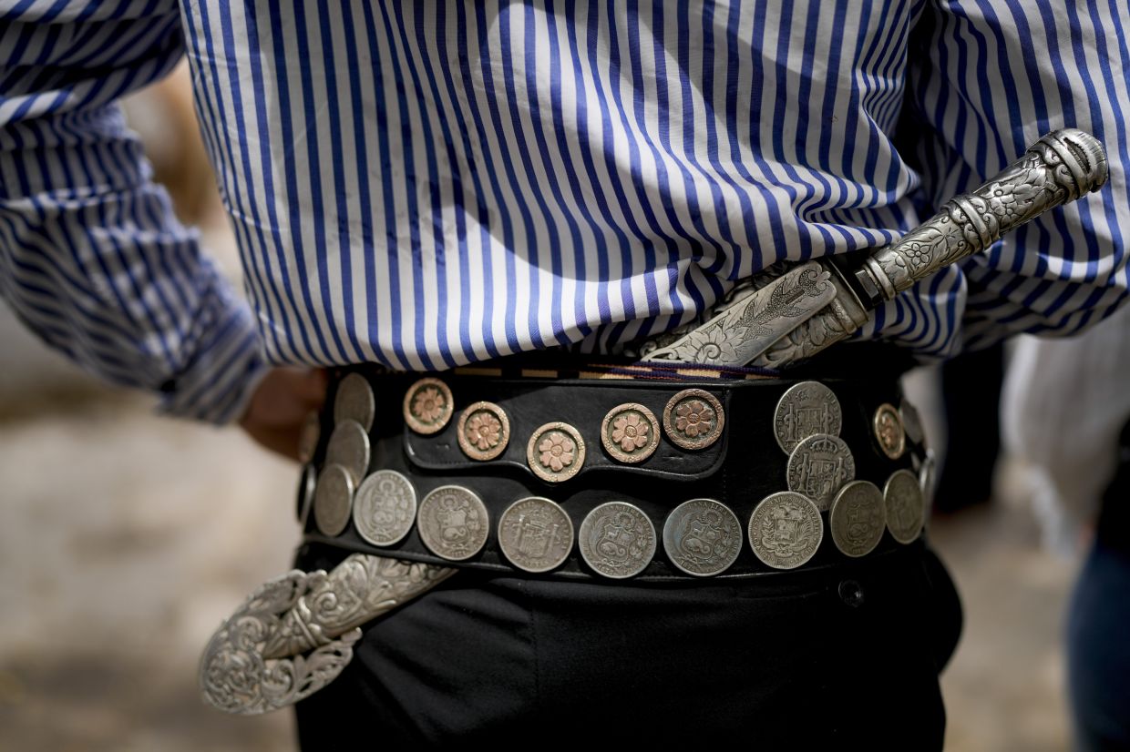 A gaucho keeps a knife in his belt during Tradition Day, aimed to preserve gaucho traditions, in San Antonio de Areco, Argentina. Photo: AP 