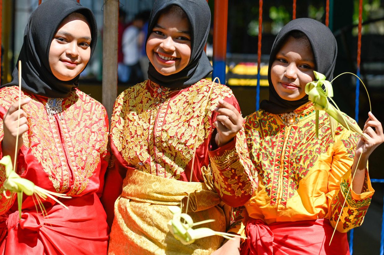 Dancers show their handmade crafts during a cultural festival at the Nusa eco-tourism village, Aceh province on Sunday, November 27, 2022. - AFP