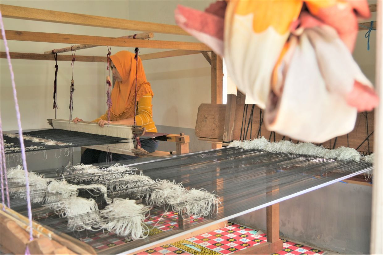 The Sepatokimin Iniative highlights the work of weavers from Singkawang who craft intricate and symbolic motifs on kain songket. Photo: Handout