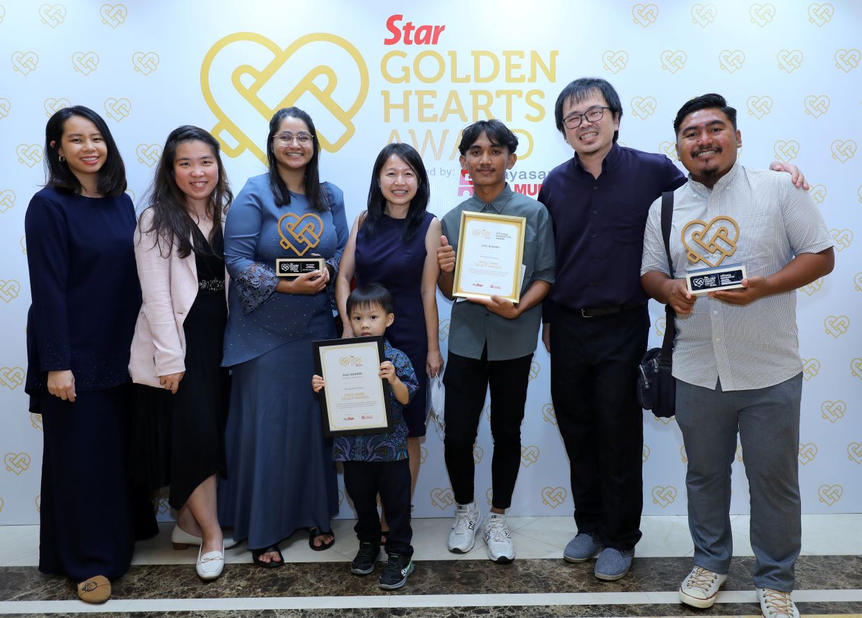 The team posing with their award. — SAMUEL ONG/The Star