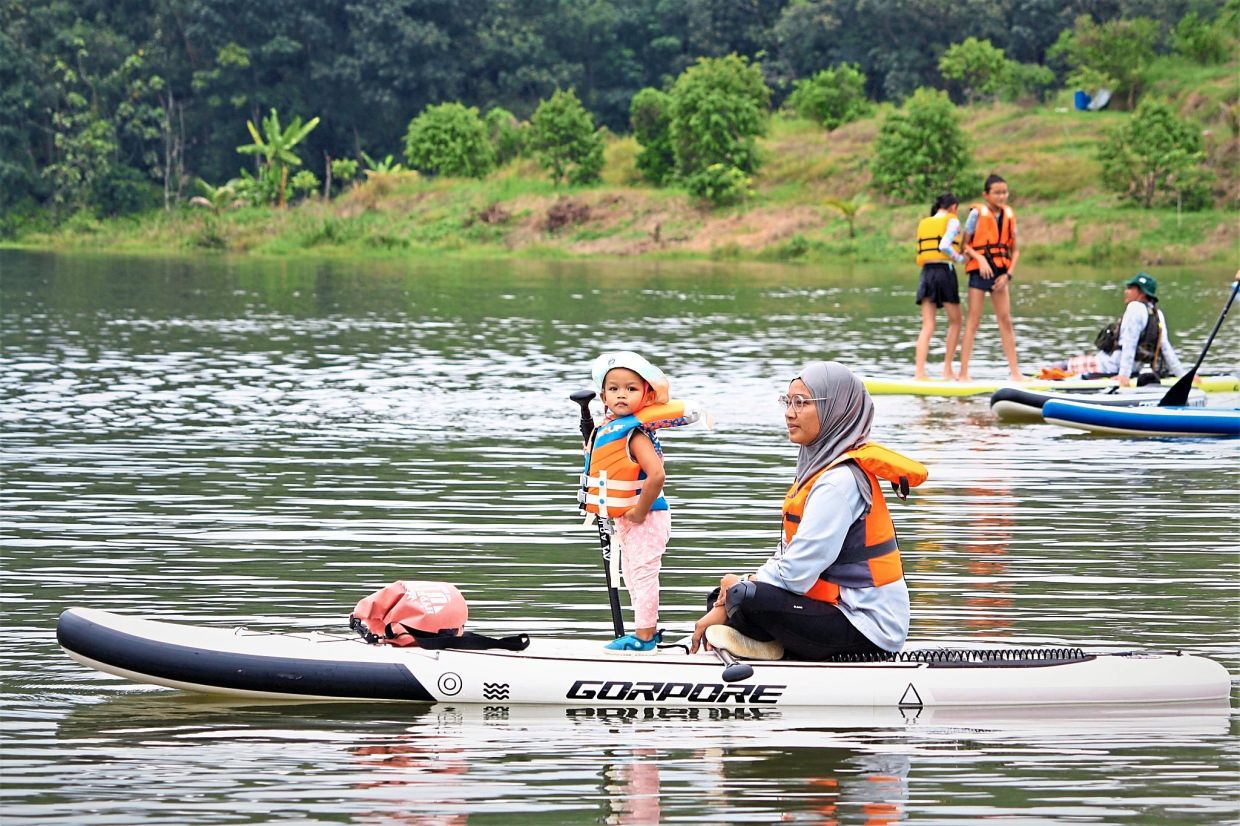 Emily with her kid paddle.