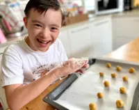 Down Syndrome Malaysian boy bakes treats to raise funds for country's first children's hospice
