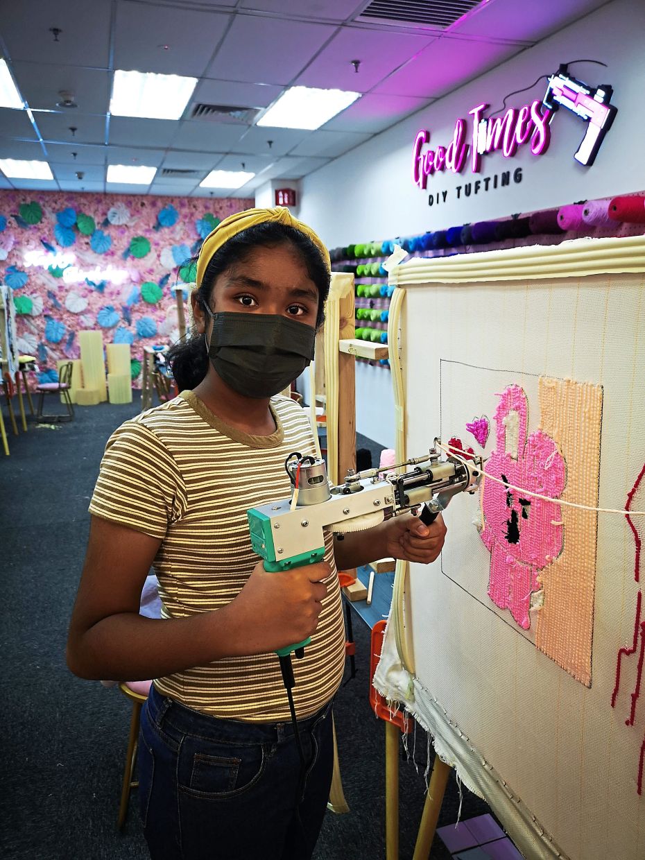 Desiree enjoys tufting, especially the idea of using the tufting gun to “shoot” yarn into the fabric.