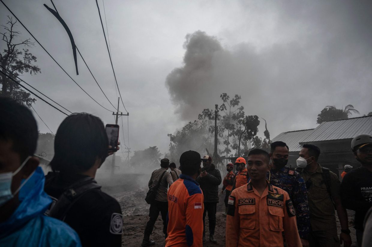 Members of a search and rescue team check the situation at the Kajar Kuning village in Lumajang on Monday, December 5, 2022. - AFP