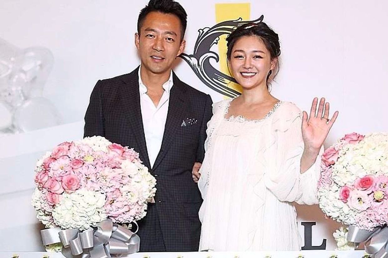 Once upon a time: Hsu with Wang at the opening of a hotel in Taipei before they divorced earlier this year.