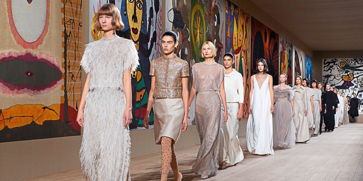 Designers all over the world are now more aware of the right way to pay tribute to culture and heritage. Seen in the background of the Dior couture show are tapestries woven by artisans from India. Photo: Dior
