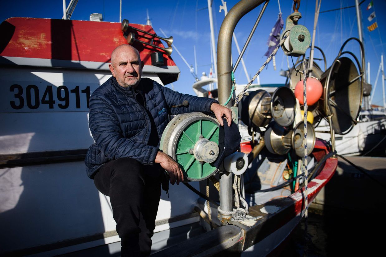 Decugis on his boat at the Saint-Rafael harbour in southeastern France.