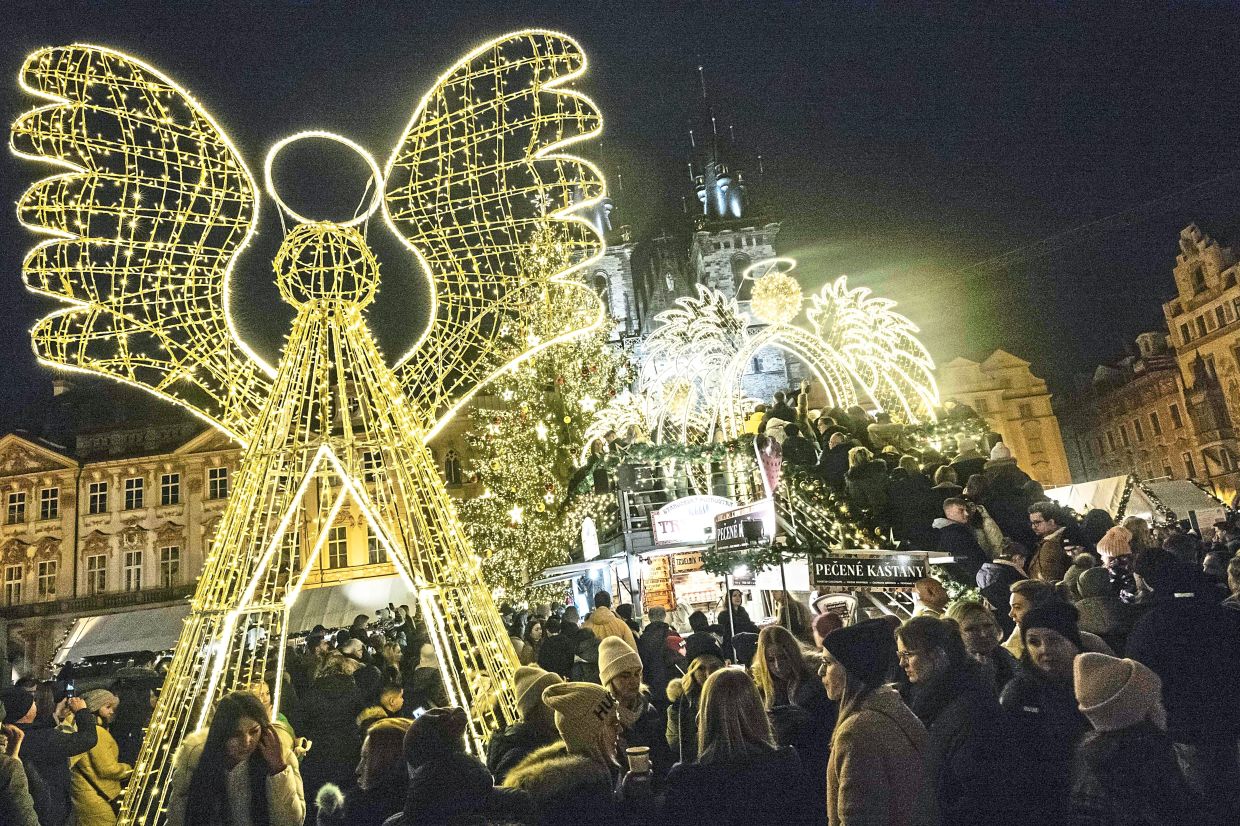 Lit-up decorations and ornaments can still be seen at the market, thanks to energy-saving bulbs. — AFP