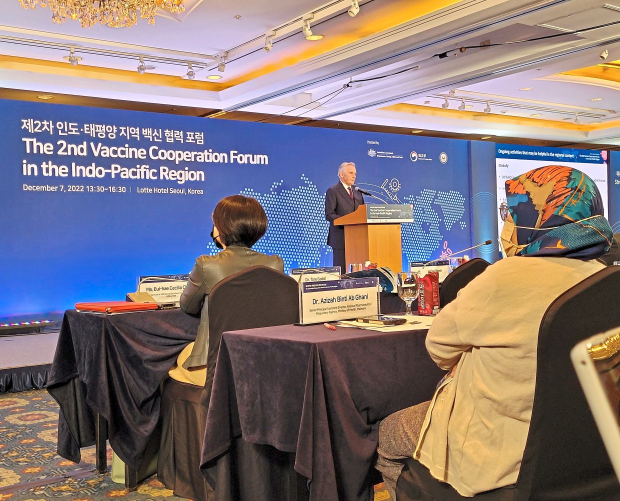 Gavi founding president and Cepi special advisor Dr Tore Godal giving the keynote speech at the forum. Listening is Dr Azizah (right). — TAN SHIOW CHIN/The Star