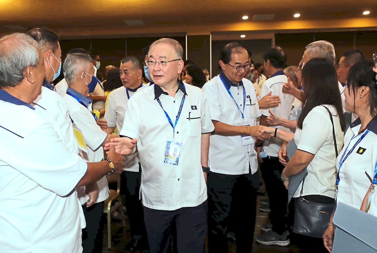 Jovial chat: Dr Wee and MCA deputy president Datuk Dr Mah Hang Soon greeting party members attending the 69th AGM that was held behind closed doors. — Photo taken from Dr Wee’s Facebook page