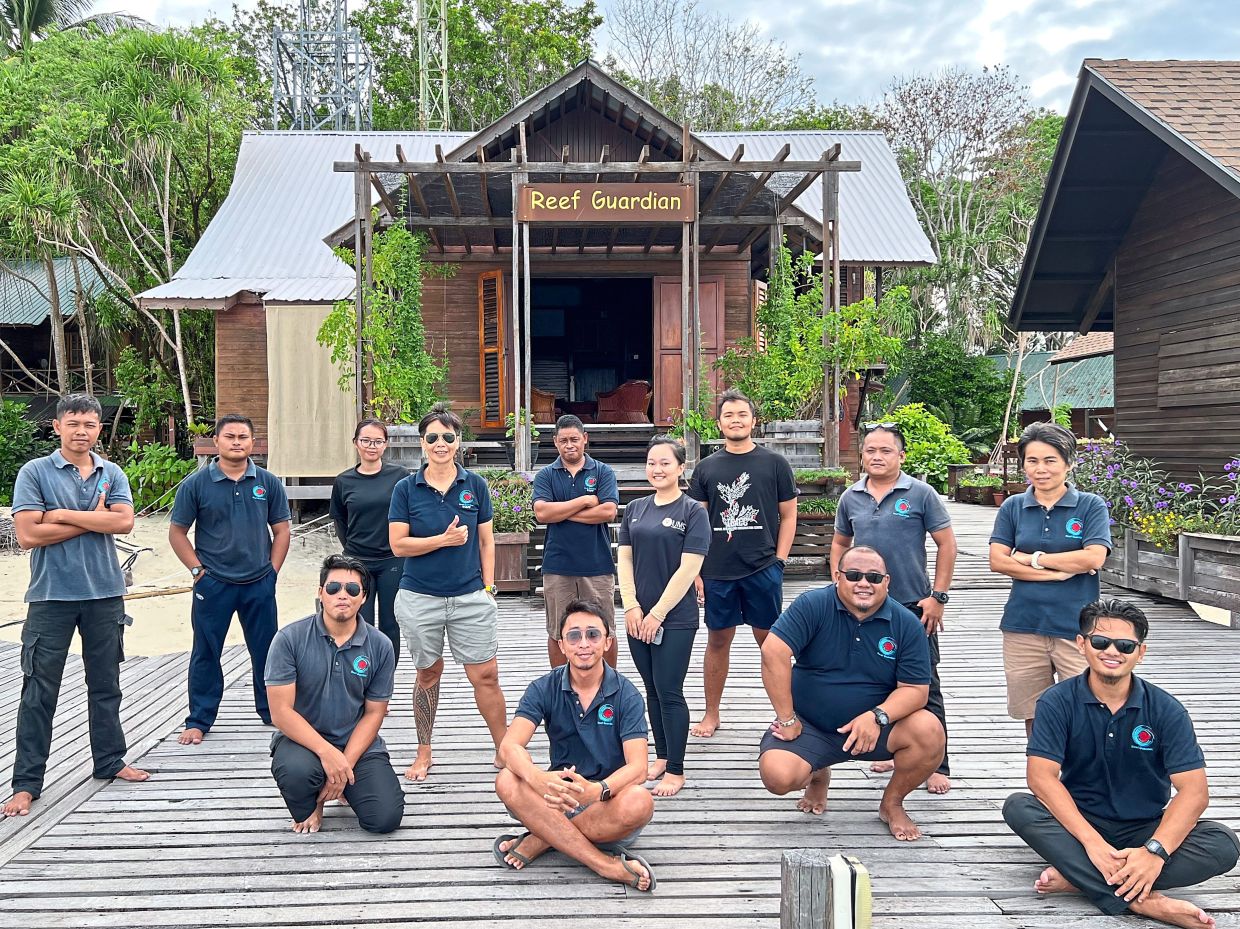 Dr Chung (standing, fourth from left) and her Reef Guardian team members are responsible for managing SIMCA. — Photos: Reef Guardian