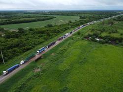 Hundreds of trucks snarl Bolivia farm region as blockades hit business