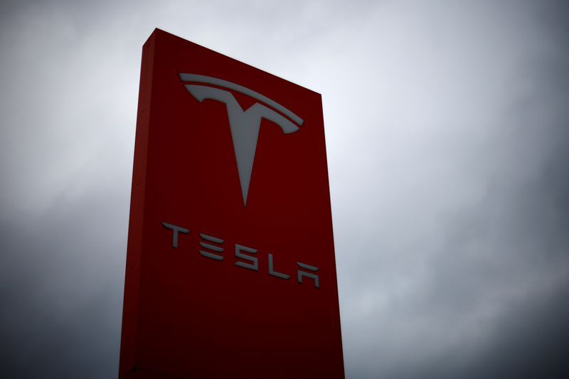 FILE PHOTO The logo of Tesla is pictured at a dealership in Chambourcy near Paris France December 15 2021. REUTERSGonzalo Fuentes
