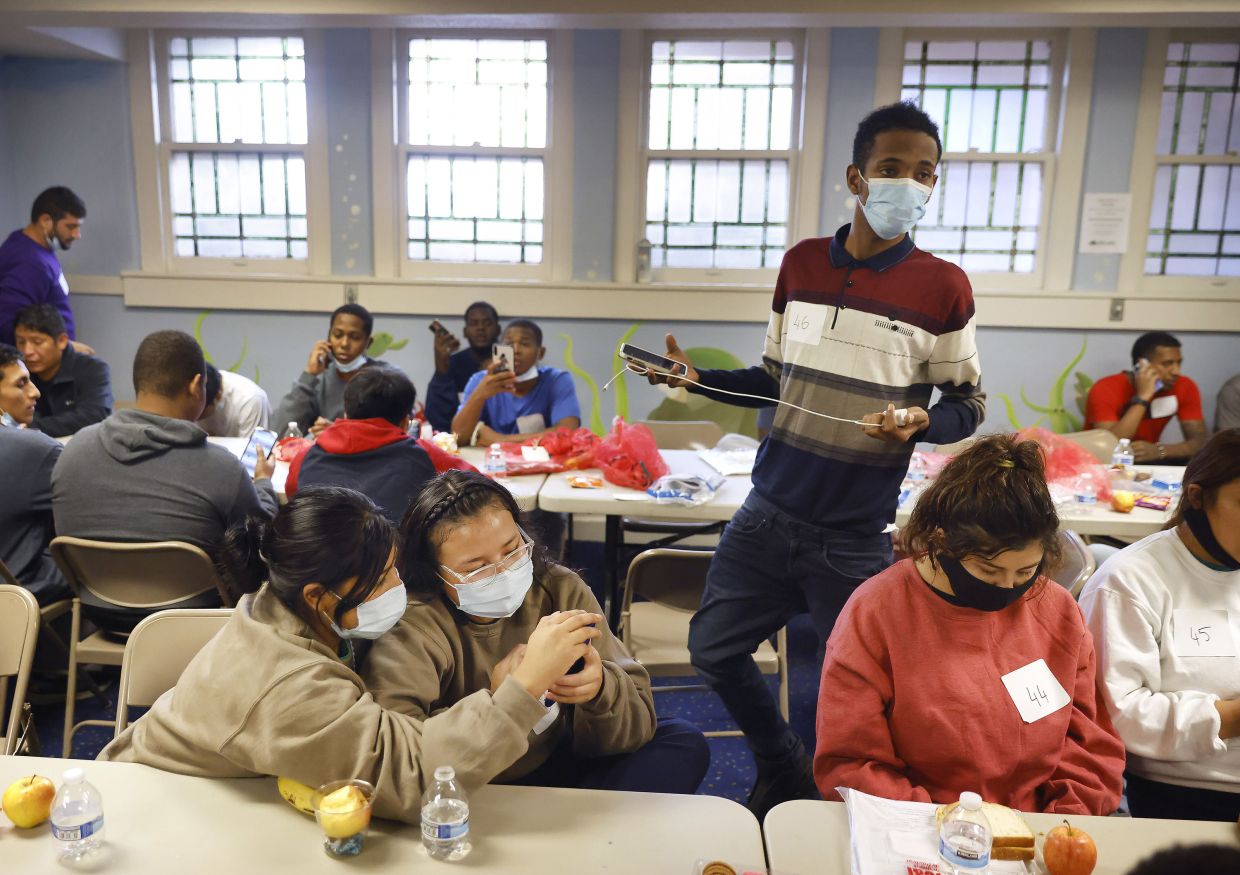 The more than 50 migrants at the Oak Lawn United Methodist Church after crossing the border. Volunteers helped them arrange travel so they can connect with family or sponsors.