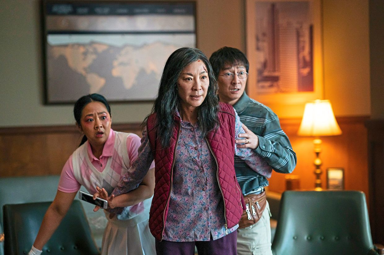 Award-winning star: Yeoh in a scene from ‘Everything Everywhere All At Once’ with Stephanie Hsu (left) and Ke Huy Quan. — AP