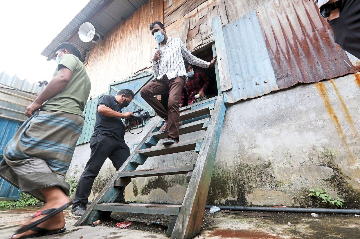 Cramped: Labour Department officers checking on the living conditions of foreign workers at a factory premises in Klang. — AZLINA ABDULLAH/The Star