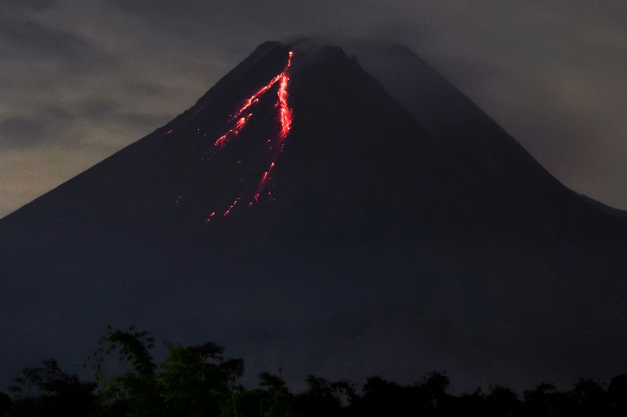 Mount Merapi, as seen from the Indonesian regency of Sleman on the island of Java, spews lava during an eruption on Saturday, January 28, 2023. - AFP