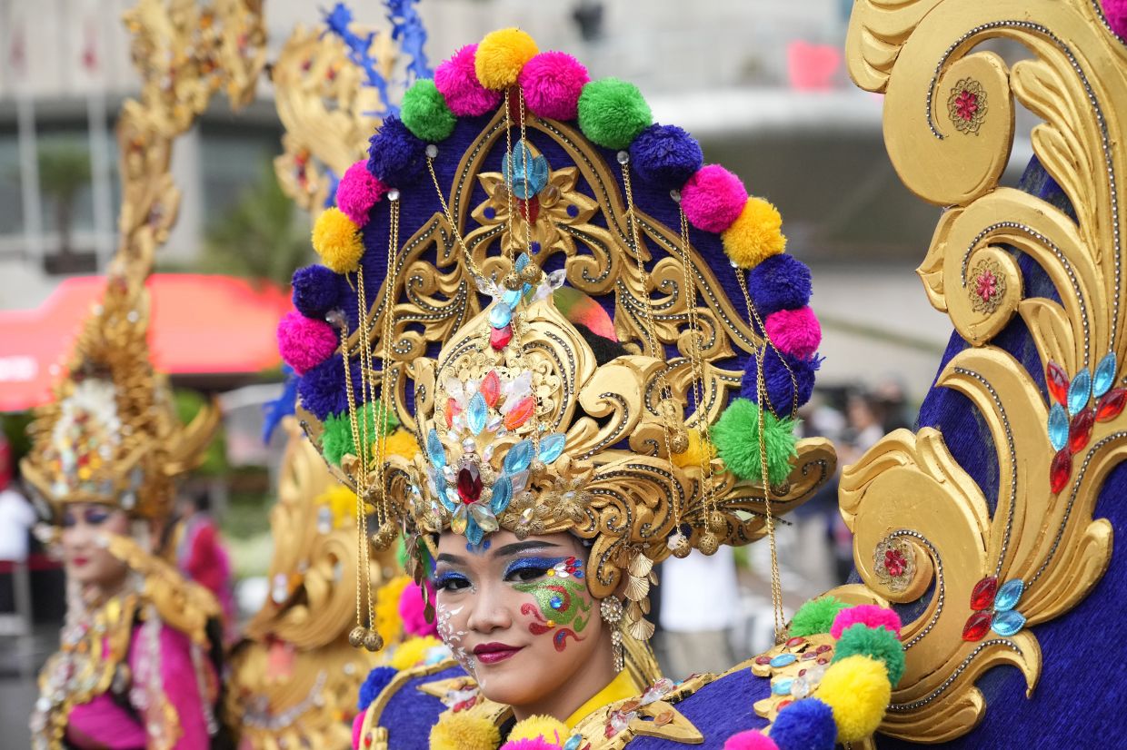 A model wears a traditional dress during the Kick Off 2023 Asean Indonesian Chairmanship in Jakarta, Indonesia, on Sunday, Jan. 29, 2023. Indonesia will chair the association in 2023. - AP