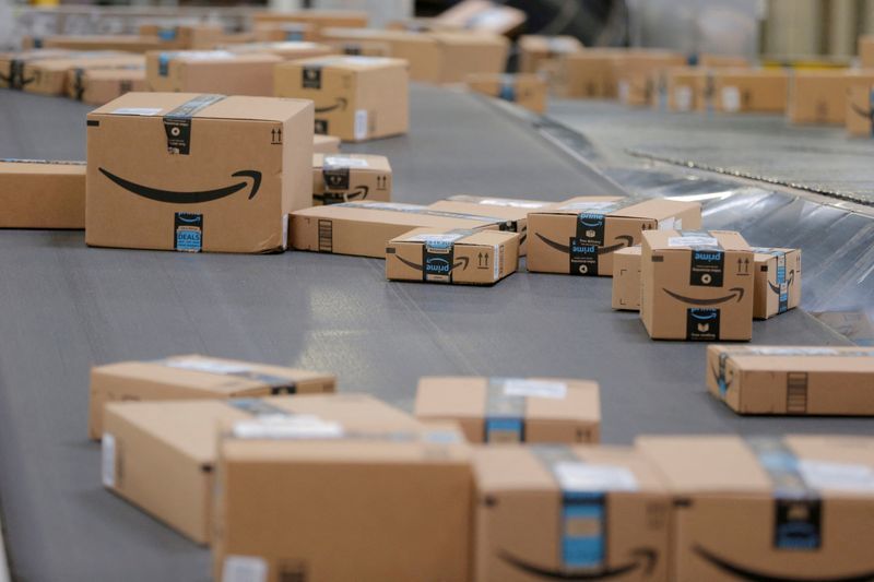 FILE PHOTO Packages emblazoned with Amazon logos travel along a conveyor belt inside of an Amazon fulfillment center in Robbinsville New Jersey U.S. November 27 2017. REUTERSLucas JacksonFile Photo