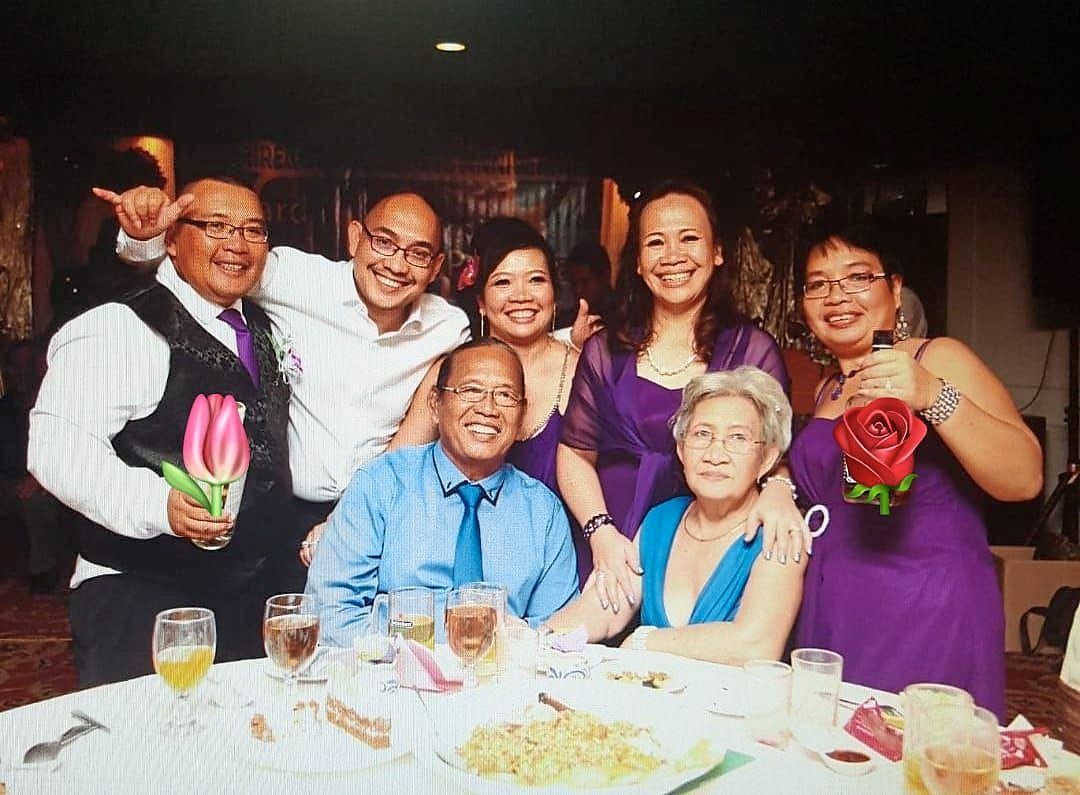 The Palon family, consisting of Edward (sitting, left), his wife (sitting, right) and their five children, including Angela (second from right), in 2018. — Photos: EDWARD PALON