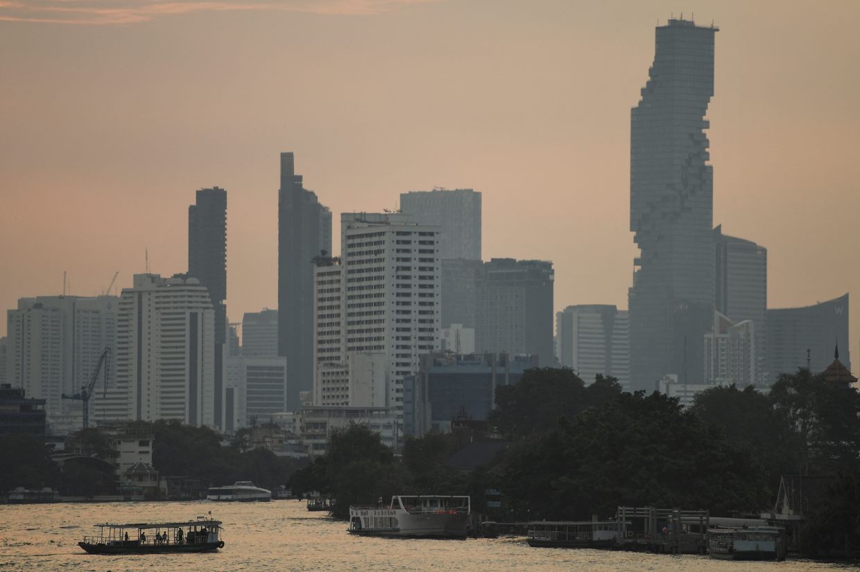 A view of Chao Phraya River, amid air pollution, during sunrise in Bangkok,  Thailand. - Reuters