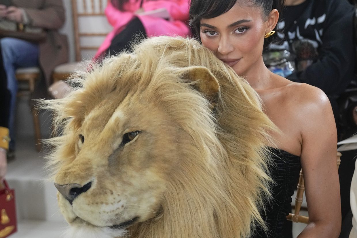 Kylie Jenner kicked up a storm of reactions on social media when she attended the Schiaparelli couture show with a lion head on her shoulder. Photo: AP