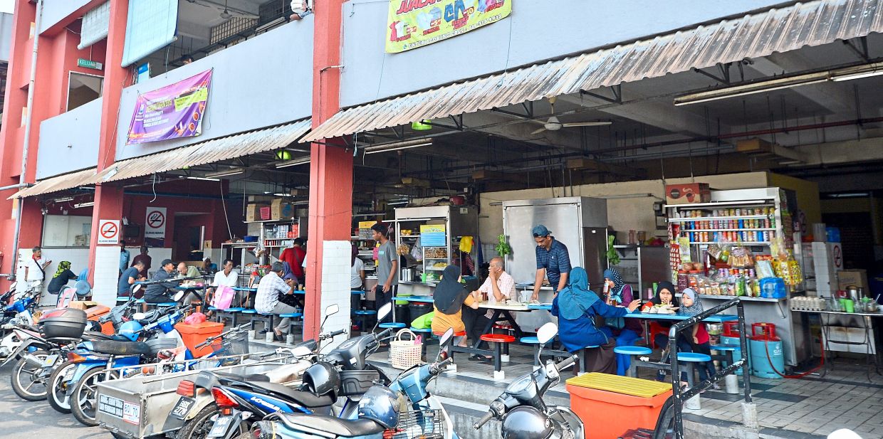 Filepic of a food court in the Klang Valley, a place patronised mainly by people from the B40 community. Higher spending on social security initiatives can spark a multiplier effect because direct fiscal injections such as welfare assistance provide short-term cash liquidity to lower income households who have a higher propensity to consume.