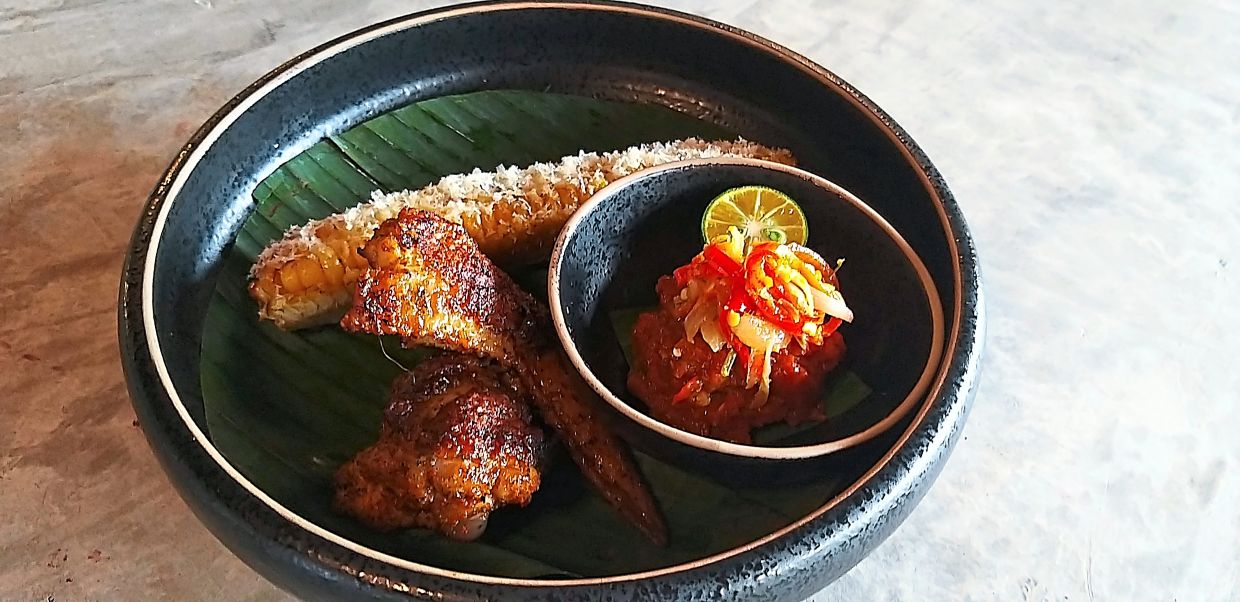 Corn ribs and Javanese-style chicken wings are one of the highlights of the tasting menu.