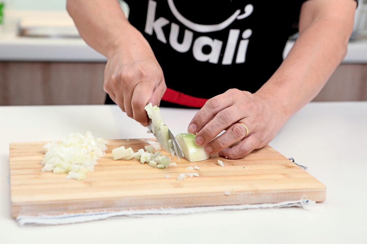 Saute onions and garlic in melted butter until wilted before adding flour to cook for about two minutes.