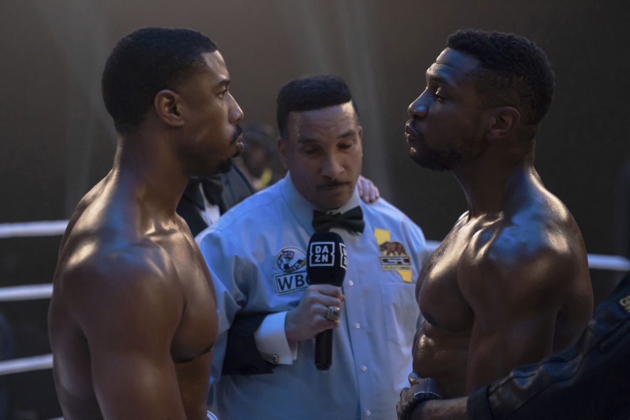 Michael B. Jordan as Adonis Creed (left), and Jonathan Majors as Damian Anderson.