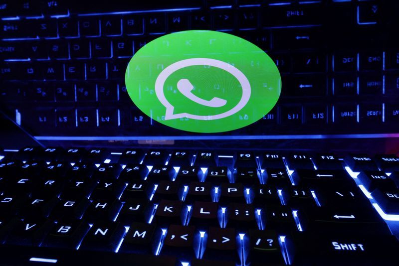 FILE PHOTO A keyboard is placed in front of a displayed WhatsApp logo in this illustration taken February 21 2023. REUTERSDado RuvicIllustration