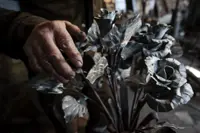 The flowers of war: Ukraine blacksmith turns guns, ammo into art